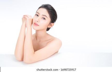 Closeup Portrait Of Beauty Asian Woman With Fair Perfect Healthy Glow Skin Hand Touch Shoulder Copy Space, Young Beautiful Asia Girl With Pretty Smile On Face. Beauty Korean Clinic Skincare Banner