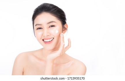 Closeup Portrait Of Beauty Asian Woman With Fair Perfect Clear Healthy Glow Skin Hand Apply Lotion, Young Beautiful Asia Girl With Pretty Smile On Face. Beauty Korean Clinic Facial Skincare Banner