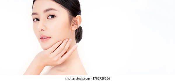 Closeup portrait of beauty asian woman with fair perfect healthy glow skin hand touching shoulder copy space, young beautiful asia girl with pretty smile face. Beauty korean women spa skincare banner
