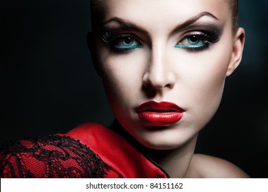 Close-up Portrait Of Blonde Woman With Red Lips