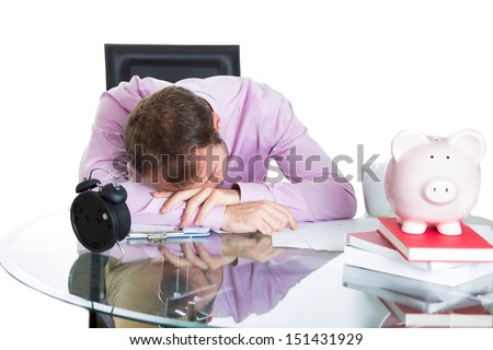 A close-up portrait of a businessman, corporate worker who fell asleep being exhausted working on his project whole day, isolated on a white background. Work place, desk, station.
