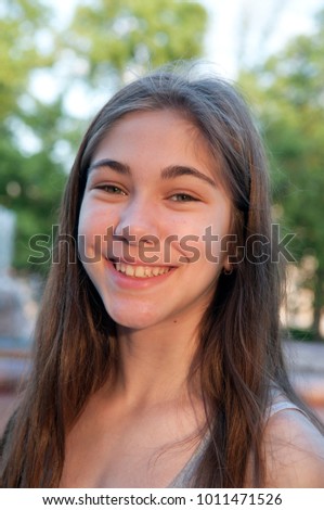 Similar – Image, Stock Photo Portrait of a beautiful young woman outdoor smiling