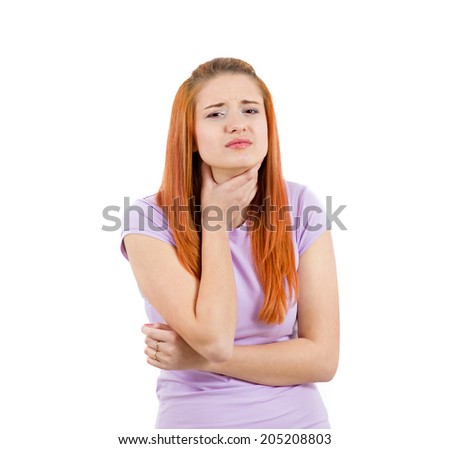Closeup portrait charming young, sad woman in t-shirt with terrible throat pain, touching her neck with hand isolated white background. Human face expression emotion, reaction. Health problems concept Stock photo © 