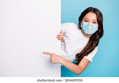 Close-up Portrait Cheerful Cheery Wavy-haired Girl Demonstrating Empty Space Ad Advert Point Finger Covid Outbreak News Wear Medical Mask Isolated Bright Shine Blue Color Background