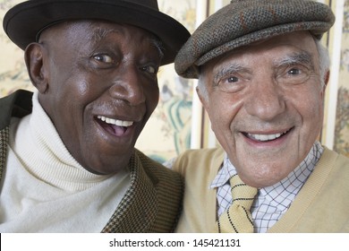 Closeup portrait of cheerful multiethnic senior men smiling