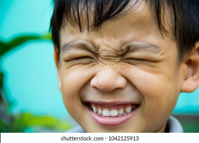 close-up portrait of child. He expresses emotions in the face. - Shutterstock ID 1042125913