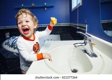 Closeup Portrait Of Child Kid Toddler Boy Girl In Bathroom Toilet Washing Face Hands Playing With Water, Lifestyle Home Style, Everyday Moments, Morning Bedtime Routine