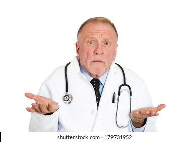 Closeup portrait of clueless senior mature health care professional, old doctor with stethoscope, has no answer, doesn't know right diagnosis, isolated on white background. Emotion facial expression
