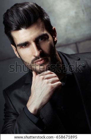 Similar – Young man with lost look in a modern pub.