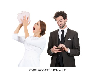 Closeup Portrait Couple, Stressed Woman Holding Shaking Empty Piggy Bank, Looking Upset From Financial Problems, Happy Business Man Pulling Out Cash Money From Wallet With Smirk On Face Isolated White