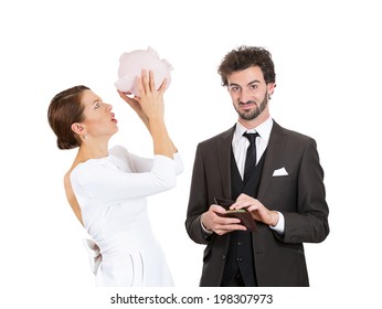 Closeup Portrait Couple, Stressed Woman Holding Shaking Empty Piggy Bank, Looking Upset From Financial Problems, Happy Business Man Pulling Out Cash Money From Wallet With Smirk On Face Isolated White