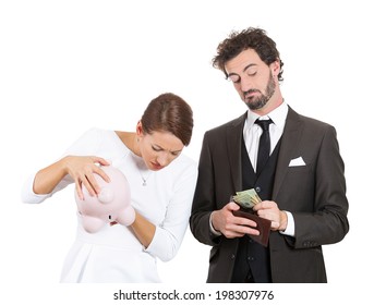 Closeup Portrait Couple, Stressed Woman Holding Shaking Empty Piggy Bank, Looking Upset From Financial Problems, Happy Business Man Pulling Out Cash Money From Wallet With Smirk On Face Isolated White