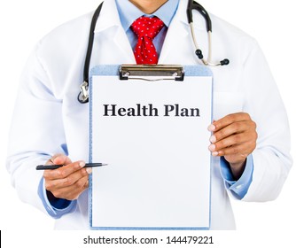 Closeup Portrait Of Cropped Health Care Professional With Stethoscope And Red Tie, Holding A Sign Which Says Health Plan And Showing Space For Text With Pen, Isolated On White Background