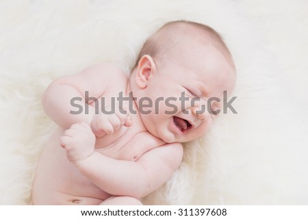 Similar – Newborn baby awake on a blanket