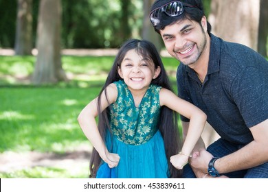 Closeup Portrait, Cute Dad And Daughter Posing Showing Off Muscles, Isolated Outdoors Outside Background