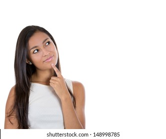 Closeup portrait of cute pretty smiling young woman, student thinking hand on chin looking up having an idea, isolated on white background. Positive emotions, facial expressions, feelings, attitude