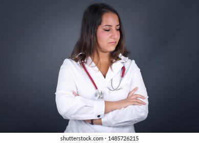 Closeup Portrait Displeased Pissed Off Angry Grumpy Doctor Woman With Bad Attitude, Arms Crossed Looking Sideways. Negative Human Emotion Facial Expression Feelings