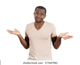 Closeup portrait of dumb, clueless young funny, smiling man, arms out asking what's problem who cares so what, I don't know, isolated on white background. Negative human emotions, facial expressions