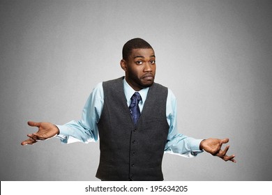 Closeup Portrait Dumb Looking Clueless Business Man, Arms Out Asking Why What's Problem, So What I Don't Know Isolated Grey Background. Negative Human Emotion Facial Expression Feeling Life Perception