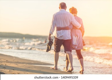 Close-up portrait of an elderly couple hugging on seacoast - Powered by Shutterstock