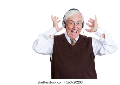 Closeup Portrait Of An Elderly Man, Senior Executive, Retired Guy, Grandpa With Headphones Listening To The Radio, Enjoying Music And His Life, Isolated On A White Background. Positive Human Emotions