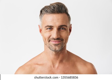 Closeup portrait of european half naked man 30s having bristle smiling at camera isolated over white background