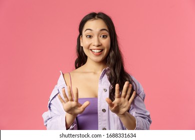 Close-up Portrait Of Excited, Cheerful Asian Girl Made Manicure, Thanking Master At Nail Salon, Feel Amazed And Happy, Looking At Hands Happy, Fantastic Job, Standing Pink Background