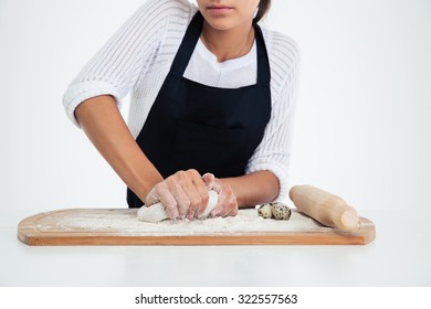 Closeup portrait of a female hands preparing dough for pastry isolated on a white background - Shutterstock ID 322557563