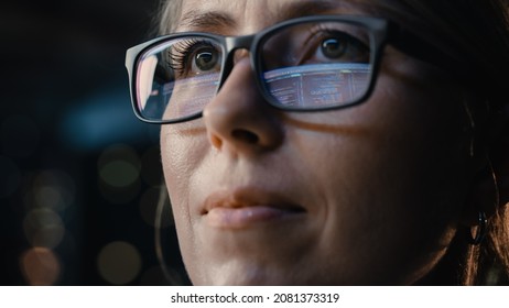 Close-up Portrait of Female Software Engineer Working on Computer, Programming Reflecting in Glasses. Developer Working on Innovative e-Commerce Application using Machine Learning, AI, Big Data