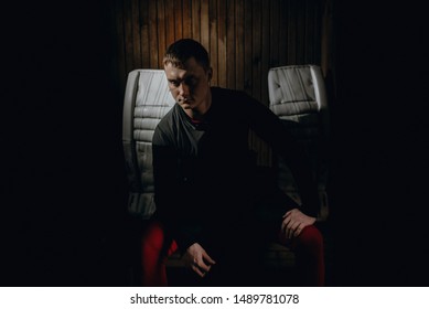 Closeup Portrait Of A Focused Hockey Goalie. Sports Photography. A Professional Ice-hockey Player In Uniform.