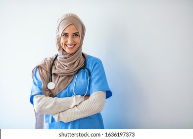 Closeup portrait of friendly, smiling confident muslim female nurse. Authentic Confident Middle Eastern Healthcare Worker. Middle age senior arab nurse woman wearing hijab over isolated background - Shutterstock ID 1636197373