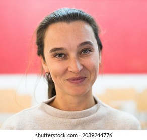 Close-up Portrait Of Full-face European Woman With Cute Smile On Her Face