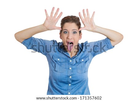 Closeup portrait of funny angry young childish bully woman sticking her tongue out at you camera gesture, isolated on white background. Negative emotions facial expression feelings. Signs, symbols