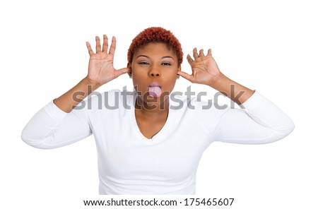 Closeup portrait of funny, angry, young, childish rude bully woman sticking tongue out at you camera gesture, isolated on white background. Negative emotions facial expression feelings. Signs, symbols