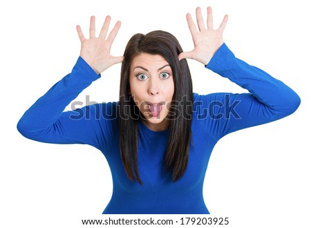 Closeup portrait of funny, angry, young, childish rude bully woman sticking tongue out at you camera gesture, isolated on white background. Negative emotions facial expression feelings. Signs, symbols