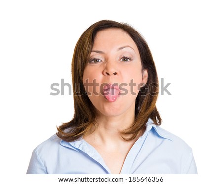 Closeup portrait, funny, angry, young, childish rude bully woman sticking tongue out at you camera gesture, isolated white background. Negative emotions facial expression feelings. Signs, symbols