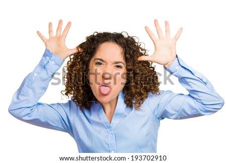 Closeup portrait funny, angry, young, childish, foolish rude bully woman sticking tongue out at you camera gesture, isolated white background. Negative emotion facial expression feelings. Signs symbol