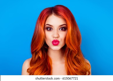 Close-up Portrait Of Funny Attractive Cute Girl With Long Ginger With Dye Ombre Fair Hair Pout Lips While Standing On Blue Background