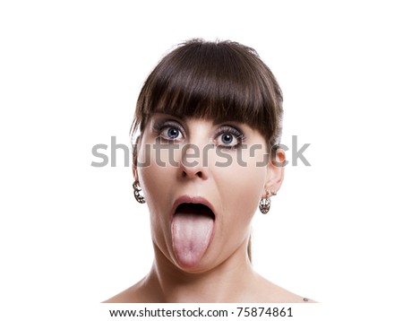 Close-up portrait of a funny woman put tongue out, isolated on white background