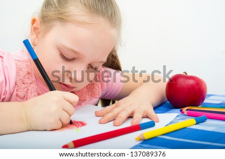 Closeup portrait of girl drawing with colorful pencils