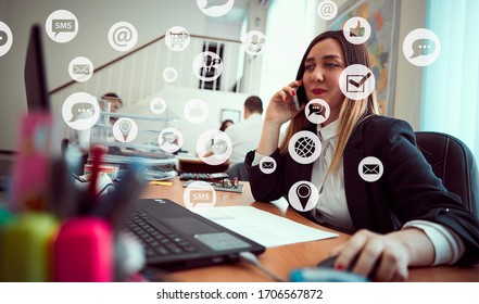 Closeup portrait of girl with phone working behind laptop holding mouse in her hands. Around icons with cloud technologies, internet, thumbs up, digital marketing, shopping cart with plus sign, social - Powered by Shutterstock