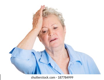 Closeup Portrait, Goofy, Senior Mature, Woman Slapping Hand On Head, Duh, Doh, Isolated White Background. Negative Human Emotion Facial Expression Feelings, Body Language