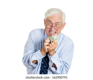 Closeup Portrait Of Greedy Senior Executive, CEO, Boss, Old Corporate Employee, Mature Man, Shaking, Holding Dollar Banknotes, Isolated On White Background. Negative Human Emotions, Facial Expressions