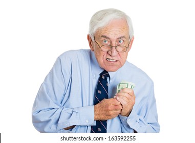 Closeup Portrait Of Greedy Senior Executive, CEO, Boss, Old Corporate Employee, Mature Man, Holding Dollar Banknotes Tightly, Isolated On White Background. Negative Human Emotion Facial Expression