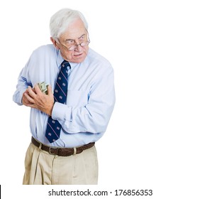 Closeup Portrait Of Greedy Senior Executive, CEO, Boss, Old Corporate Employee, Business Man, Holding Dollar Banknotes Tightly, Hiding, Possessive, Isolated On White Background. Negative Human Emotion