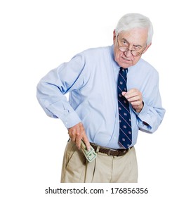 Closeup Portrait Of Greedy Senior Executive, CEO, Boss, Old Corporate Employee, Business Man, Holding Dollar Banknotes Tightly, Hiding, Possessive, Isolated On White Background. Negative Human Emotion