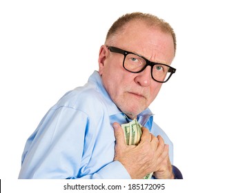 Closeup Portrait, Greedy Senior Executive, CEO, Boss, Old Corporate Employee, Mature Man, Holding Dollar Banknotes Tightly, Isolated White Background. Negative Human Emotion Facial Expression