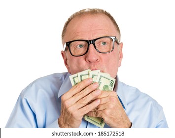 Closeup Portrait, Greedy Senior Executive, CEO, Boss, Old Corporate Employee, Mature Man, Holding, Kissing Dollar Banknotes In Hand, Isolated White Background. Negative Human Emotion Facial Expression