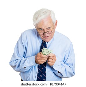 Closeup Portrait Greedy Senior Executive, CEO, Boss, Old Corporate Employee, Business Man, Holding Dollar Banknotes Tightly, Isolated White Background. Negative Human Emotion Facial Expression Feeling