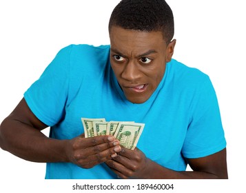 Closeup Portrait Greedy Student, Corporate Employee, Worker Funny Looking Business Man, Holding Dollar Banknotes, Money, Suspicious, Sarcastic, Isolated White Background. Face Expressions